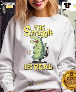 Alt Text: Funny dinosaur sweatshirt with 'The Struggle Is Real' text, perfect for humor lovers and cozy outfits.