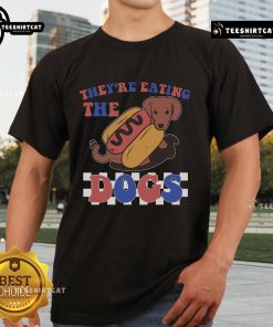 Funny They're Eating The Dogs Independence Day T-Shirt featuring a humorous design for July 4th celebrations.