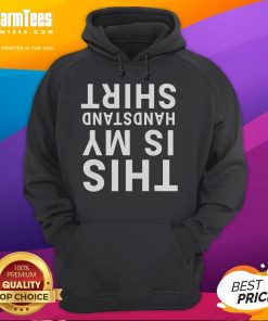 Person in a Funny This Is My Handstand hoodie doing acrobatics upside down in a gym setting.