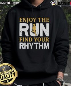 Runner wearing a hoodie, enjoying a run, embracing the rhythm of jogging in a scenic outdoor setting.