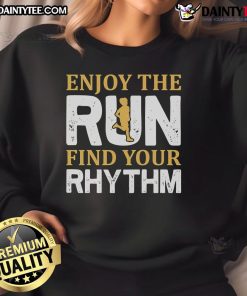 Runner wearing a motivational sweatshirt, enjoying a run while finding their rhythm in jogging and fitness.