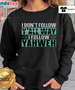 Christian believer sweatshirt with 'Good, I Don't Follow Y'all, I Follow Yahweh' graphic design for faith-inspired fashion.