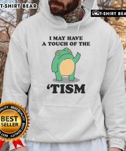 Person wearing a 'Good I May Have A Touch Of The Tism' hoodie, showcasing neurodivergent humor in a casual style.