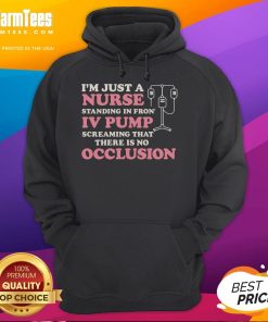 Good I'm Just A Nurse hoodie worn by a nurse standing in front of an IV pump, showcasing healthcare pride and professionalism.
