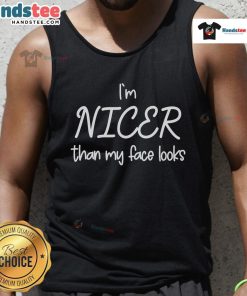 Model wearing 'Good Im Nicer Than My Face Looks' tank top, showcasing a casual and stylish look for summer fashion.