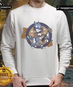 Man wearing Good Jammin' Out Harley Ambertail Games sweatshirt, enjoying a vibrant outdoor atmosphere.