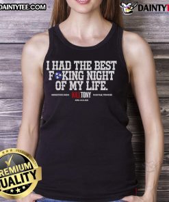 Person wearing a 'Good Kill Tony Best Fucking Night Of My Life' tank top, smiling at a lively event, capturing fun moments.