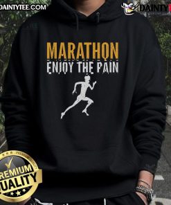 Runner wearing 'Enjoy The Pain' hoodie at a half marathon, showcasing determination and passion for marathon running.