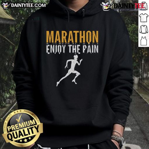 Runner wearing 'Enjoy The Pain' hoodie at a half marathon, showcasing determination and passion for marathon running.