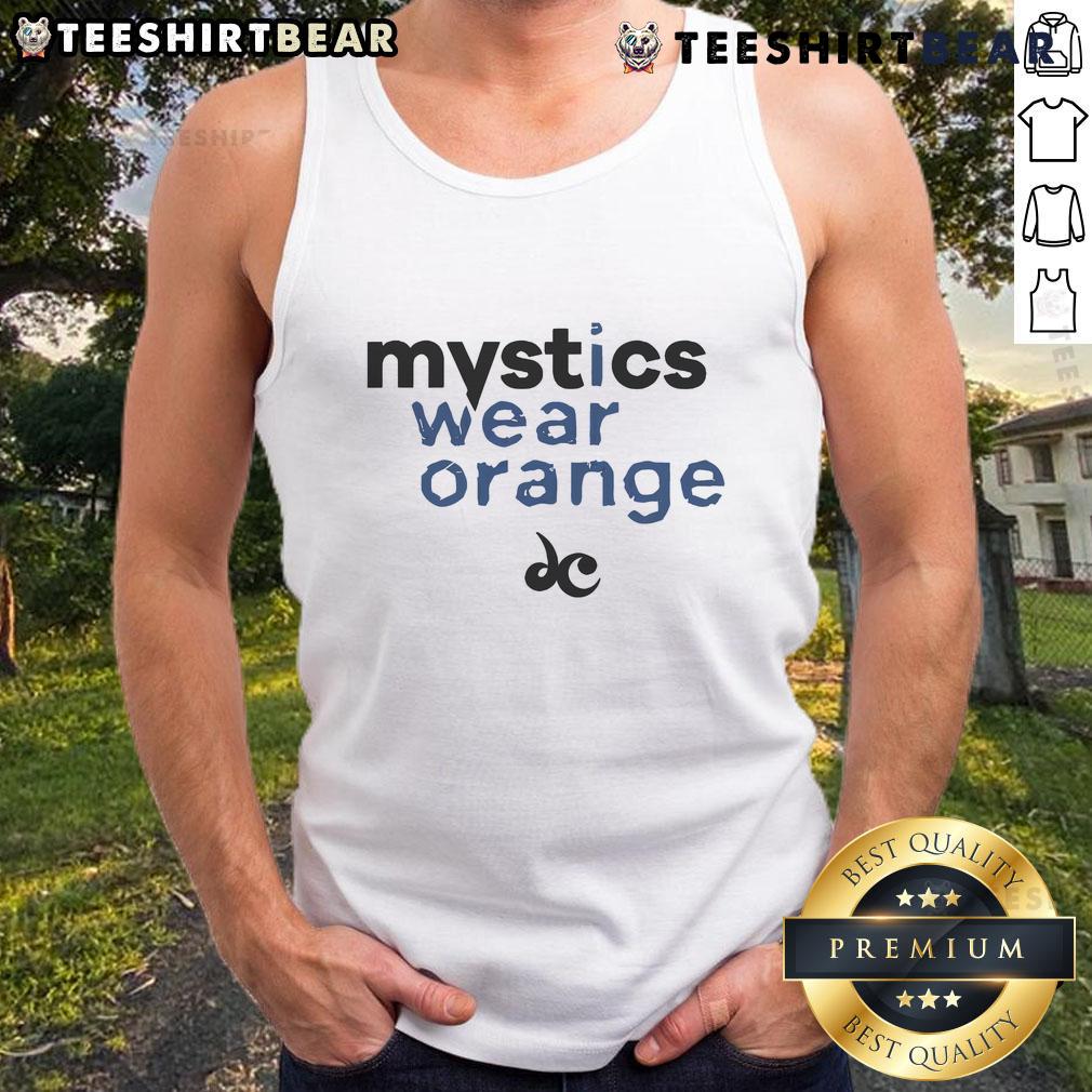 Good Mystics Wear Orange Tank Top Good Mystics Wear Orange Tank Top - A stylish orange tank top worn by a mystic in a serene outdoor setting.