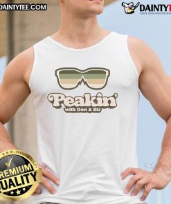 Good Peakin' with Don Biz tank top displayed on a model, showcasing trendy streetwear fashion and vibrant colors.