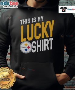 Alt Text: A fan wearing a 'Good Pittsburgh Steelers This Is My Lucky Hoodie' celebrates in the stands during a game.