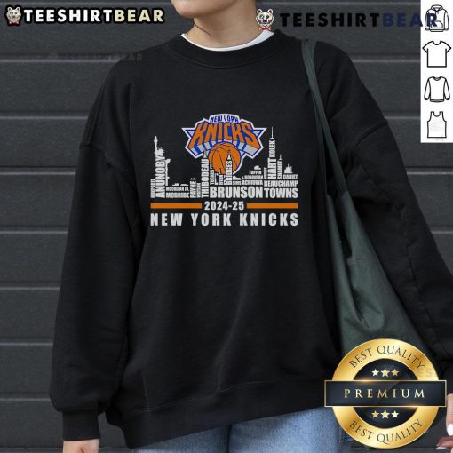 New York Knicks players' names sweatshirt featuring vibrant city skyline design for 2024-25 season.