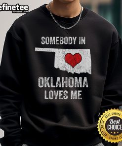 Cozy 'Good Somebody In Oklahoma Loves Me' sweatshirt in a casual setting, perfect for showing Oklahoma pride and comfort.
