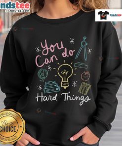 Alt Text: Teacher wearing a 'You Can Do Hard Things' sweatshirt on a good testing day, inspiring students during exams.