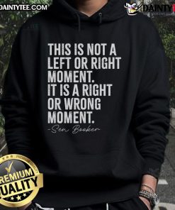 Senator Cory Booker wearing a hoodie with the phrase Good-This-Is-Not-A-Left-Or-Right-Moment during a public event.