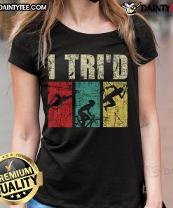 Happy triathlete in retro vintage tee showcasing swim, run, and bike themes for ladies' triathlon apparel.