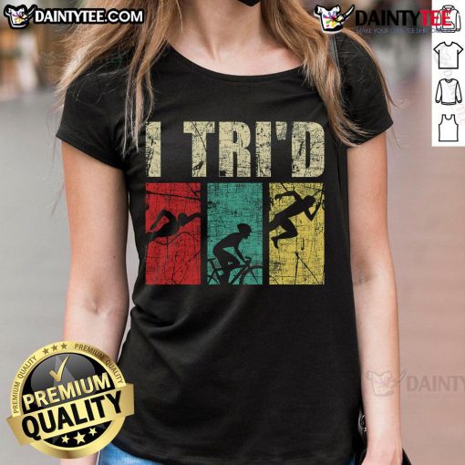 Happy triathlete in retro vintage tee showcasing swim, run, and bike themes for ladies' triathlon apparel.