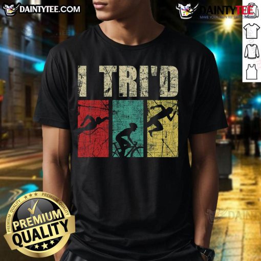 Alt Text: Happy I Tri'D Retro Vintage Triathlon T-Shirt featuring a colorful design of a triathlete swimming, biking, and running.