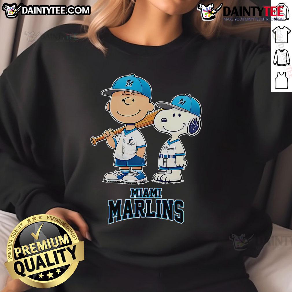 Happy Miami Marlins Charlie Brown And Snoopy Baseball Cartoon Fan Sweatshirt Alt Text: Happy Miami Marlins Charlie Brown and Snoopy baseball cartoon fan sweatshirt featuring vibrant colors and playful design.