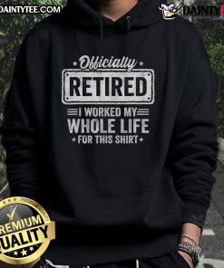 Happy retired person wearing a 'Officially Retired' hoodie, celebrating a lifetime of hard work and achievement.