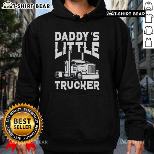 Alt Text: Happy child wearing a 'Daddy's Little Trucker' hoodie, excitedly standing next to a colorful semi-truck.
