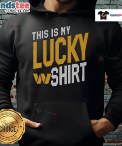 Happy fan wearing a Washington Commanders hoodie, celebrating team spirit and good luck at a game.