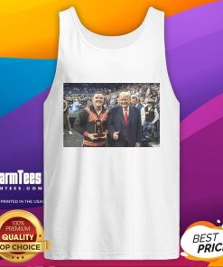 Alt Text: Wyatt Hendrickson wearing a tank top featuring Donald Trump, showcasing the hot best boss in the business theme.