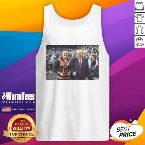 Alt Text: Wyatt Hendrickson wearing a tank top featuring Donald Trump, showcasing the hot best boss in the business theme.