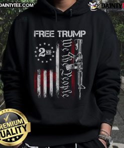 Hot Free Trump Supporter wearing Pro-Trump We The People American Flag Hoodie at a rally, showcasing patriotic style.
