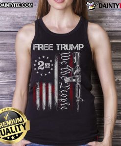 Hot pro-Trump supporter wearing a 'We The People' American flag tank top, showcasing patriotism and style.