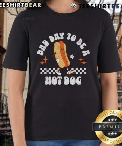 4th of July ladies tee featuring a fun checkered design and 'Bad Day to Be a Hot Dog' graphic for festive celebrations.