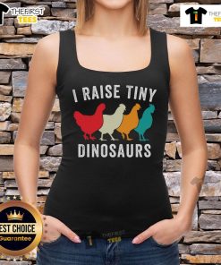 Chickens in the backyard with a tank top reading 'I Raise Tiny Dinosaurs' for chicken lovers and homesteaders.