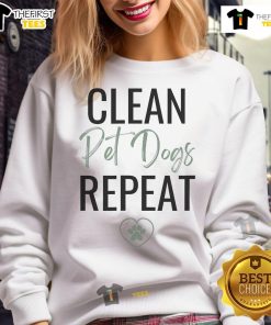 Nice cleaning lady wearing a dog lover sweatshirt for cleaning business, smiling in a tidy home environment.
