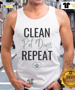 Nice cleaning lady wearing a dog lover tank top, ready for her cleaning business, smiling and holding cleaning supplies.