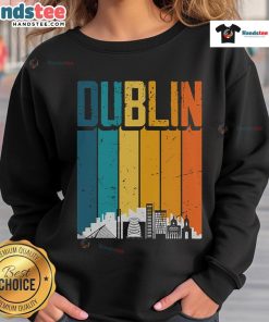 Alt Text: Vintage sunset skyline sweatshirt featuring Dublin, Irelands iconic landmarks and warm color tones.