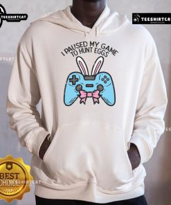 Gamer in a hoodie with 'I Paused My Game to Hunt Eggs' design, perfect for Easter gaming enthusiasts.