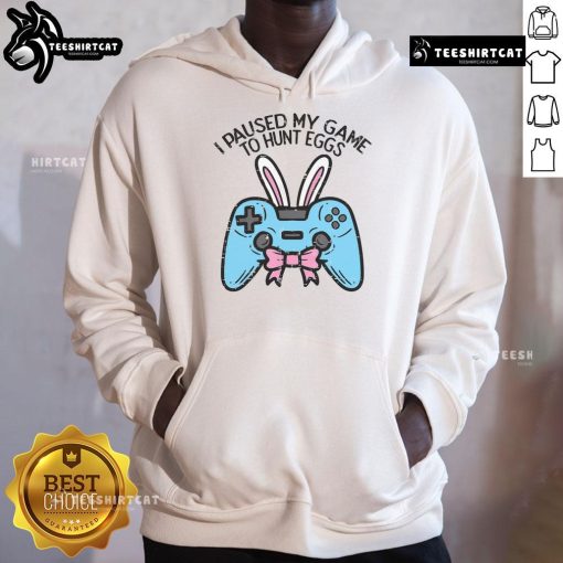 Gamer in a hoodie with 'I Paused My Game to Hunt Eggs' design, perfect for Easter gaming enthusiasts.