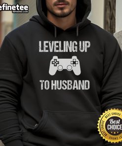 Couple in matching hoodies celebrating engagement, perfect for video game lovers, showcasing their unique style and love.