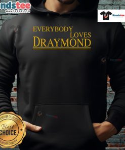 Bay Area basketball fan wearing 'Everybody Loves Draymond' hoodie, showcasing team spirit and style in vibrant colors.