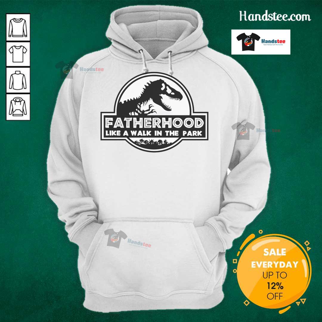 Nice Fatherhood Like A Walk In The Park Dad Dinosaur Hoodie Dad wearing a dinosaur hoodie, enjoying a walk in the park, showcasing fun and playful fatherhood moments.