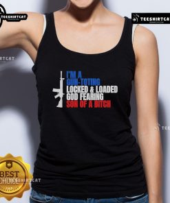 Man wearing 'I'm a Gun-Toting Locked and Loaded God-Fearing Son of a Bitch' tank top, showcasing patriotic pride and style.