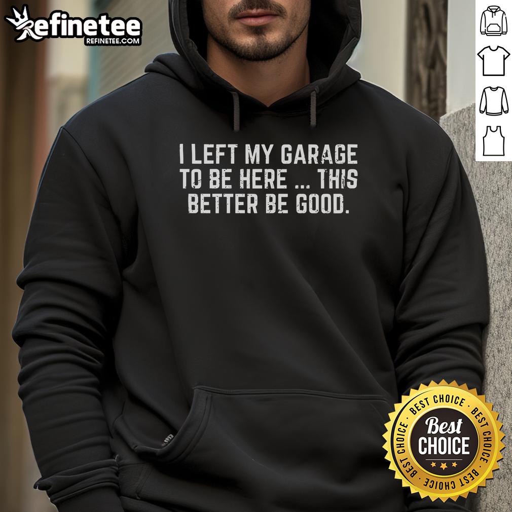 Nice I Left My Garage To Be Here Hoodie Alt Text: Stylish 'Nice I Left My Garage To Be Here' hoodie displayed on a hanger, perfect for casual wear and showcasing humor.
