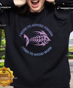 Cozy sweatshirt with the phrase 'I need to work to afford fishing, I fish to avoid work' perfect for fishing enthusiasts.