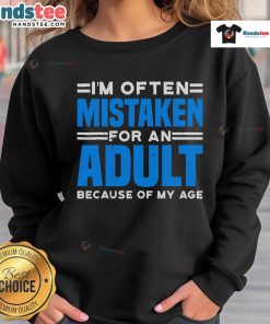 Cozy 'Nice I'm Often Mistaken For An Adult Because Of My Age' sweatshirt displayed on a mannequin in a trendy setting.