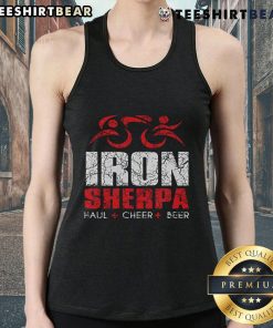 Triathlete wearing a Nice Iron Sherpa tank top, celebrating with a beer after a triathlon event.