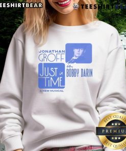 Alt Text: Jonathan Groff in a Bobby Darin musical sweatshirt, showcasing his stylish look for the production Just In Time.
