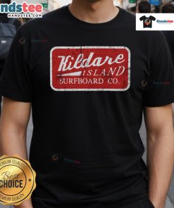 Boy wearing a retro t-shirt and John B hat, holding a surfboard on Kildare Island beach, showcasing a fun summer vibe.