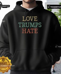 Vintage hoodie featuring 'Love Trumps Hate' slogan, perfect for expressing positivity and support for kindness.