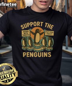 Marching penguins design on a retro t-shirt promoting economic freedom and resistance against tariffs.